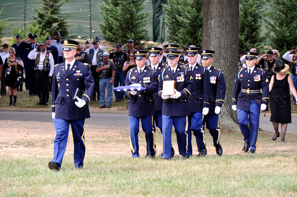 Army Chaplin Sneed leads the honor guard to the grave site.