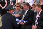 Ed Elliott is presented with his American flag.