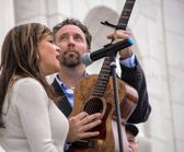 Lindsay Lawler sings God Bless America accompanied by her guitarist Chris Roberts
