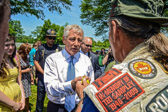 Presenting Secretary of Defense Chuck Hagel with a Bowe Bergdhal POW wrist band, asking when will he be coming Home!  “Leave No Man Behind”.