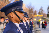 Civil Air Patrol Cadet Homes stands at attention awaiting the arrival of the Wreaths Across America caravan of trucks containing the wreaths to be laid at every grave site in Arlington National Cemetery.