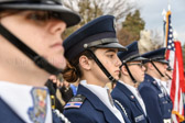 Civil Air Patrol Cadets stand at attention awaiting the arrival of the Wreaths Across America caravan of trucks containing the wreaths to be laid at every grave site in Arlington National Cemetery.