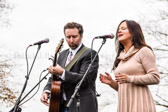 Country and Western singer Lindsay Lawler, right, and guitarist Chris Roberts sing our National Anthem during the opening ceremony for the annual Wreaths Across America event at Arlington National Cemetery in Arlington, Va., Dec. 12, 2015. Thousands of volunteers helped place over 700,000 wreaths at the graves of fallen service members