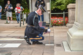 A Tomb Sentinel conducts the ceremony by placing American flags at each of the four crypts to honor all our nation’s fallen heroes at noon.