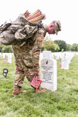 This tradition, known as "Flags in," has been conducted annually since The Old Guard was designated as the Army's official ceremonial unit in 1948. Every available soldier in the 3rd U.S. Infantry Regiment participates, placing small American flags at each headstone and at the bottom of each niche row.