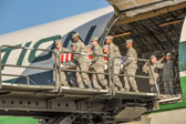 Carry team of volunteer Dover AFB personal carry the transfer case of L/Cpl. James T. Poole Jr. on K loader.