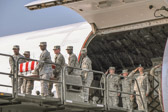 Dover AFB carry team moves up the transfer case of Pfc. Edwin C. Wood.