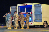 Carry team carries transfer case of Pfc. Trevor B. Adkins to the mortuary transfer vehicle