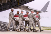 Air Force carry team carries transfer case of Capt. Reid K. Nishizuka to the mortuary transfer vehicle
