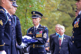 After the flag is folded, the senior pallbearer executes a Right Face and places the flag at chest level into the hands of the CAO (Casualty Assistance Officer).