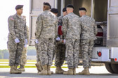 U.S. Army carry team places the transfer case of  Army Maj. Gen. Harold J. Greene into the mortuary transfer vehicle.