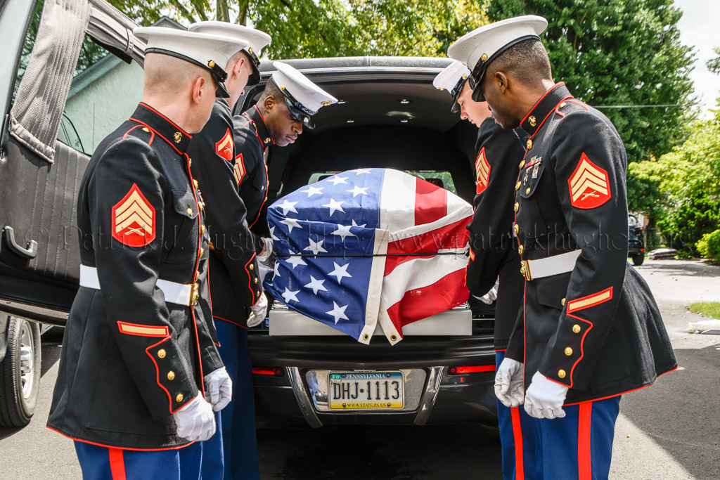 Marine body bearers prepare to move the remains of Marine Pvt Emil F. Ragucci into  the John F. Murray in  Flourtown, PA