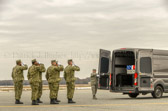 Transfer vehicle begins to pull away.  Dignified transfer officer orders final “Present, Arms” and “Order, Arms” (slow salute) as vehicle departs.