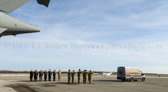 A final salute as the mortuary transfer vehicle leaves the tarmac for the base mortuary