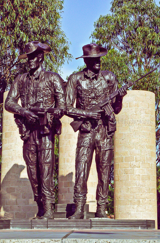 These two central figures represent two Australian soldiers facing the east and the rising sun, and represent the importance of support and comradeship represented in the Australian term, 'mates'. They wear the distinctive Australian slouch hat that carries the 'Rising Sun' badge. The figures stand on a raised podium paved in a radial pattern which refers to the Army insignia. Seven pillars represent the seven major conflicts in which the Australian Army was involved during the 20th century. They are surrounded by water, symbolic of the long sea journeys involved in Australian campaigns.