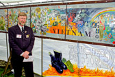 “Touched by Fire” written by Kenny Laughton. Derek Walsh the artist, who served with 8 RAR in Vietnam 1969-70, has put his talents to good use and created a moving and memorable mural recognizing Australia’s involvement in the South Vietnam from 1962 to 1975. His mural is a dedication of many hours of painting, years of research and particular attention to accurate details. It features the 508 young Australians who are recognized as our war dead, as well as the seven civilians also killed. Many objects will be familiar to most of us, every Corps featured with incidents and major battles also depicted.