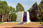 The memorial remembers those who suffered and died in the Vietnam War from 1962 to 1973. The campaign for a Vietnam memorial dates from the 'Welcome Home Parade' held in Sydney on October 3, 1987 and dedication took place exactly five years later. It is the joint work of architect Peter Tonkin and sculptor Ken Unsworth and responds to the design competition requirements to express 'the link between the Australian Vietnam Forces and the original ANZAC Force' and also to represent 'the controversy at home'. The external design was limited by ceremonial and parade considerations and by other memorials along Anzac Parade.