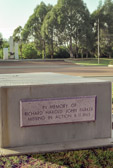 In the landscaped turf area surrounding the central building there are three concrete memorial 'seats' At each end of these memorials is the name of one of the six Australians recorded as Missing In Action.