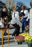 A family member of Cpl. Louis J. Rotondo pays her respects.