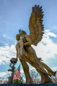 Since Angels are messengers from God, Father Van figured why not facilitate the message of ‘Divine Mercy’ by means of an Angel lifting a dead service member from the battlefield to Heaven?  By elevating the service member, the Angel directs the thoughts of those who’ve experienced the trauma of war to the mercy of God.
