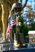 A Bronze Combat Memorial (aka, the Battle Field Cross) which is always set up in the Combat Zone for a Field Memorial Service so that all of those Killed in Action may be honored and remembered by their fellow Soldiers, Marines, Sailors, Airmen and Coast Guardsmen.
