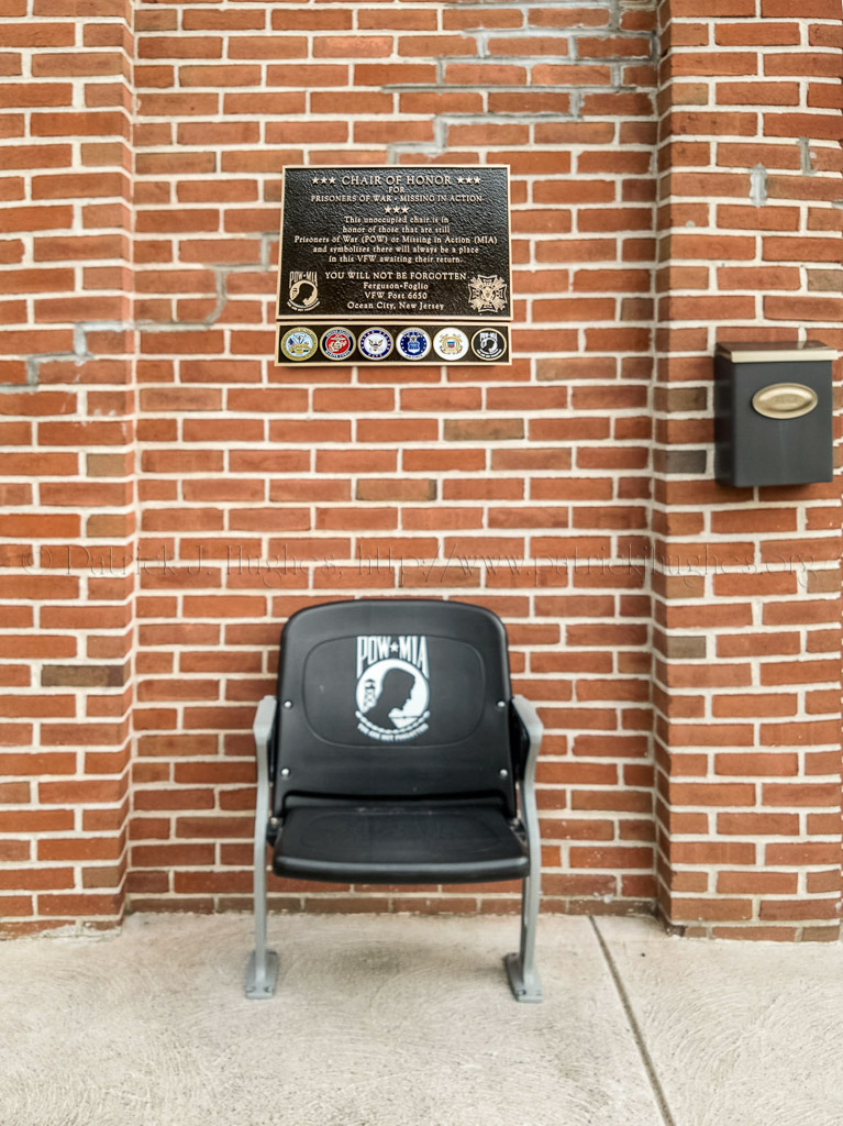 Their plaque reads as follows:<br />Chair Of Honor For Prisoners Of War ~ Missing In Action  This unoccupied chair is in honor of those that are still Prisoners of War ( POW ) or Missing in Action ( MIA ) and symbolizes there will always be a place in this VFW awaiting their return.<br />YOU WILL NOT BE FORGOTTEN<br />Ferguson ~ Foglio<br />VFW Post 6650<br />Ocean City, New Jersey