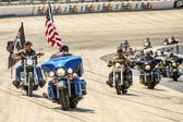 A part of the ceremonies included a slow procession of 141 motorcycles, 182 individuals around the “Monster Mile” track.  <br /><br />The riders were lead in by the Vietnam Vets M/C Chapter E  Pennsylvania.<br /> <br />Rider with the American Flag is Ronald W. Knowles US Navy Veteran Second Brigade M/C<br />Southern Chapter Quarter Master Road name....”Gilligan”<br /><br />Rider with the POW-MIA flag is Ken “Murdoc” Massey, Brothers At Arms, Vice President,  US Marine Corps and National Guard Veteran