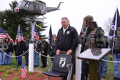 Saturday, March 19, 2016, near Dover, DE it was chilly and it rained.<br />Joe Startt Jr., left, Chapter 850 president, and Joey “Heat”, Brothers-At-Arms MC Club president, <br />unveil the POW/ MIA Chair of Honor and plaque donated by the Brothers-At-Arms MC Club.