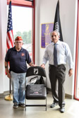 Chaplain Carmen P. Laino of the Upper Darby Marine Corps League Detachment #884 and Jeff D'Ambrosio unveiled this meaningful memorial, the POW/MIA National Chair of Honor on the main showroom floor of Jeff D'Ambrosio Auto Group, Downingtown, PA.