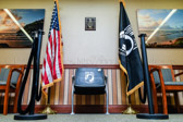 A Chair of Honor is very simple yet POWERFUL, it's a single black chair with the POW/MIA Logo on it which is then flanked by the American Flag and the POW/MIA Flag.  Along with the Chair is a plaque that sates since WWII over 82 thousand servicemen remain unaccounted for. This chair is in their honor until they come home.