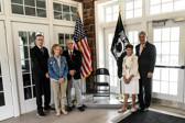 This Chair Of Honor is on permanent display at Washington Crossing National Cemetery's Administration building, in the entrance breezeway.<br /><br />Honored guests L to R: Brian Fitzpatrick, Congressman (R) from PA 1st Congressional district, Heather Evers, daughter of Vietnam MIA LtJG Edward L. Romig, Ralph W. Galati, Captain, United States Air Force, former POW, Tozia "Romig" Engleman, the former spouse of Vietnam MIA LtJG Edward L. Romig, missing in action 6/17/1966 and Kelly McKeague, Director, Defense POW/MIA Accounting Agency.