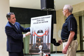 Voorhees, NJ Mayor Michael Mignogna along with Vietnam Marine Richard Schelberg unveil a photo of Voorhees Township POW/MIA National Chair Of Honor on October 21, 2019.