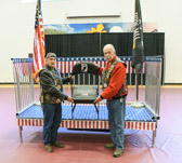 Vietnam Veterans Danny “Greasy” Belcher of Task Force Omega and Ray Manzo Founder of the 1st Rolling Thunder “Demonstration Ride For Freedom” unveiled the POW/MIA National Chair Of Honor at Rainelle Elementary School on May 27, 2022.