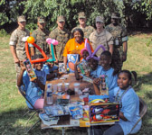 Marines 'Toys For Tots' bring gifts for the children.
