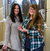 Katie Rasdorf of 'History Flight' (on left) provided challenge coins to family members of  PFC Michael Kocopy