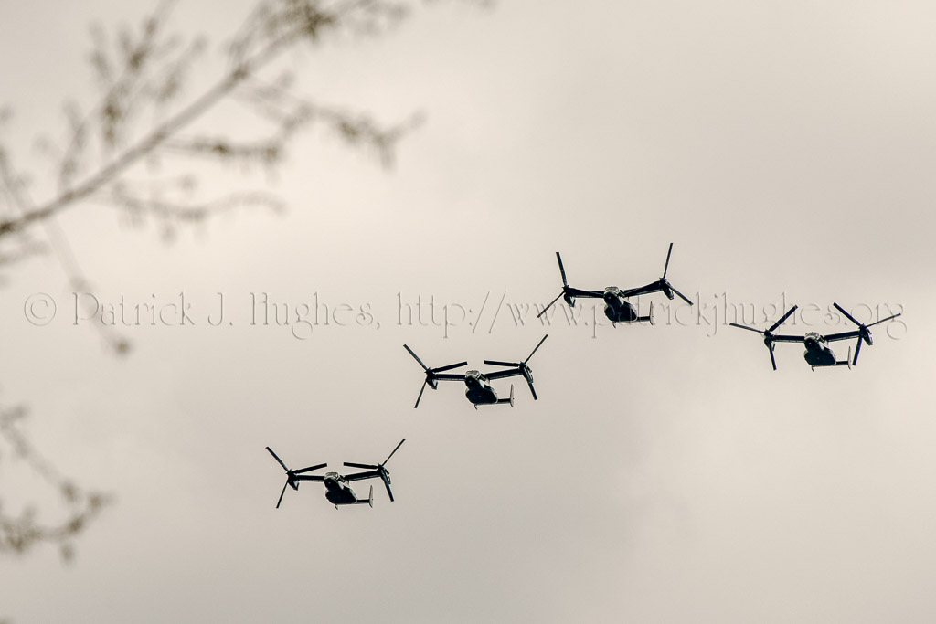 Marine Corps MV-22B Osprey fly over.