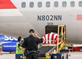 Hand Salute is call, Mike Dunn BWI Security salutes as the casket bearing the remains of PFC Raymond Warren is lowered down the ramp.