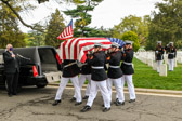 Casket is removed from hearse and moved to the caisson