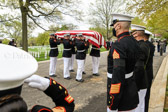 Remains of PFC. Raymond Warren are removed from caisson and carried by Marine  Body Bearers to burial site.