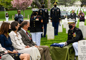 Because of Covid Marine Colonel Styskal places the flag on a small table while saying “On behalf of the president of the United States, and a grateful nation, please accept this flag as a symbol of our appreciation for your loved one's honorable and faithful service”.