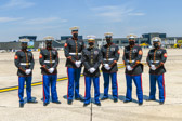 Marine Body Bearers along with 1st Lt Gabriel Foster stand at the ready for this dignified transfer of 1st Lt. Justin G. Mills