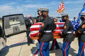 Marine Body Bearers place the casket containing the remains of 1st Lt. Justin G. Mills into the hearse.