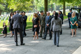 Arlington representative gives instruction to family members walking to the grave site.