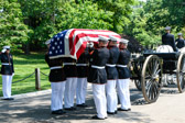 Remains of 1LT Justin Green Mills are removed from the caisson and carried by Marine Barracks Washington DC Body Bearers to burial site.