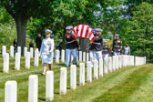 Navy Chaplain leads the way to Section 33 burial site.