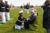 A felt bag containing casings from the rifle salute are presented to the family