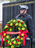 Marine Body Bearer stands watch over ceremonial wreath at the Marine Corps War Memorial in Arlington, Virginia.